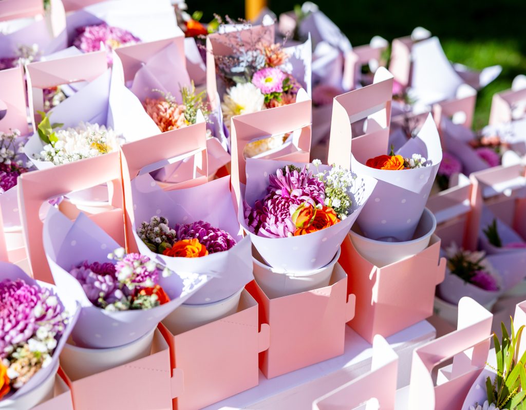 Mother's Day Bloom Boxes with flowers on one side and a drink on the other
